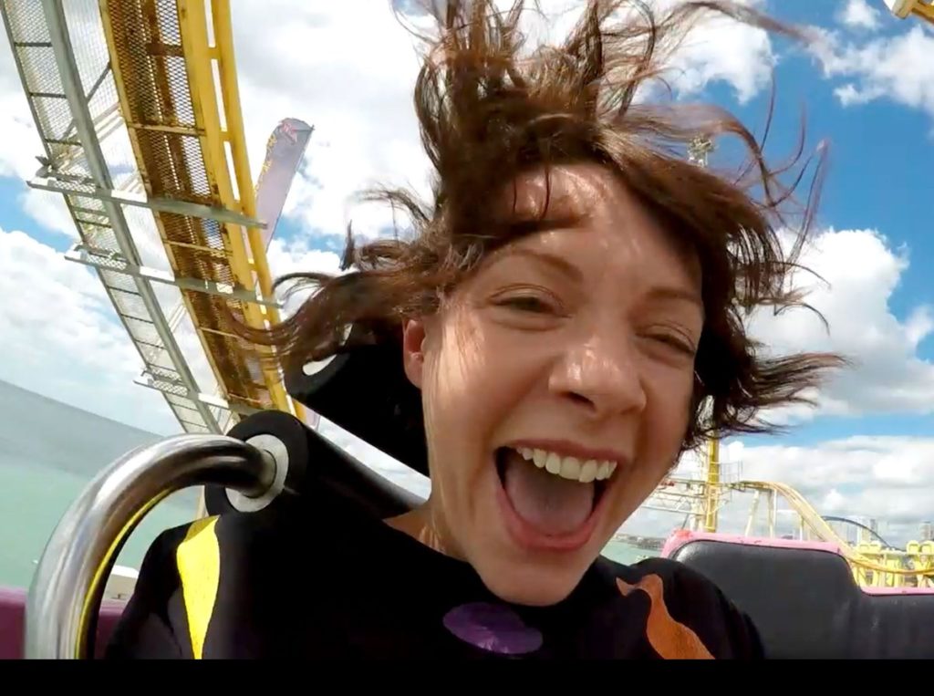 Girl with crazy hair on ride