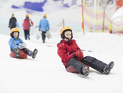Children on Luge Ice Slide at Chill Factore