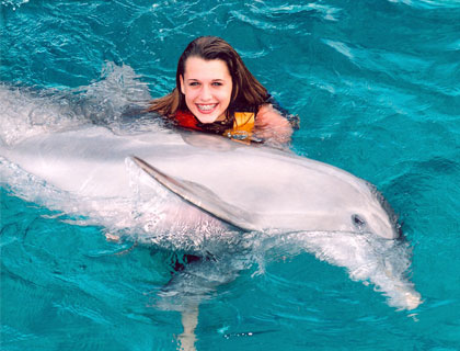 Swim with Dolphins Mayan Riviera and Fantasy Snorkel- Girls Gives Dolphin A Hug
